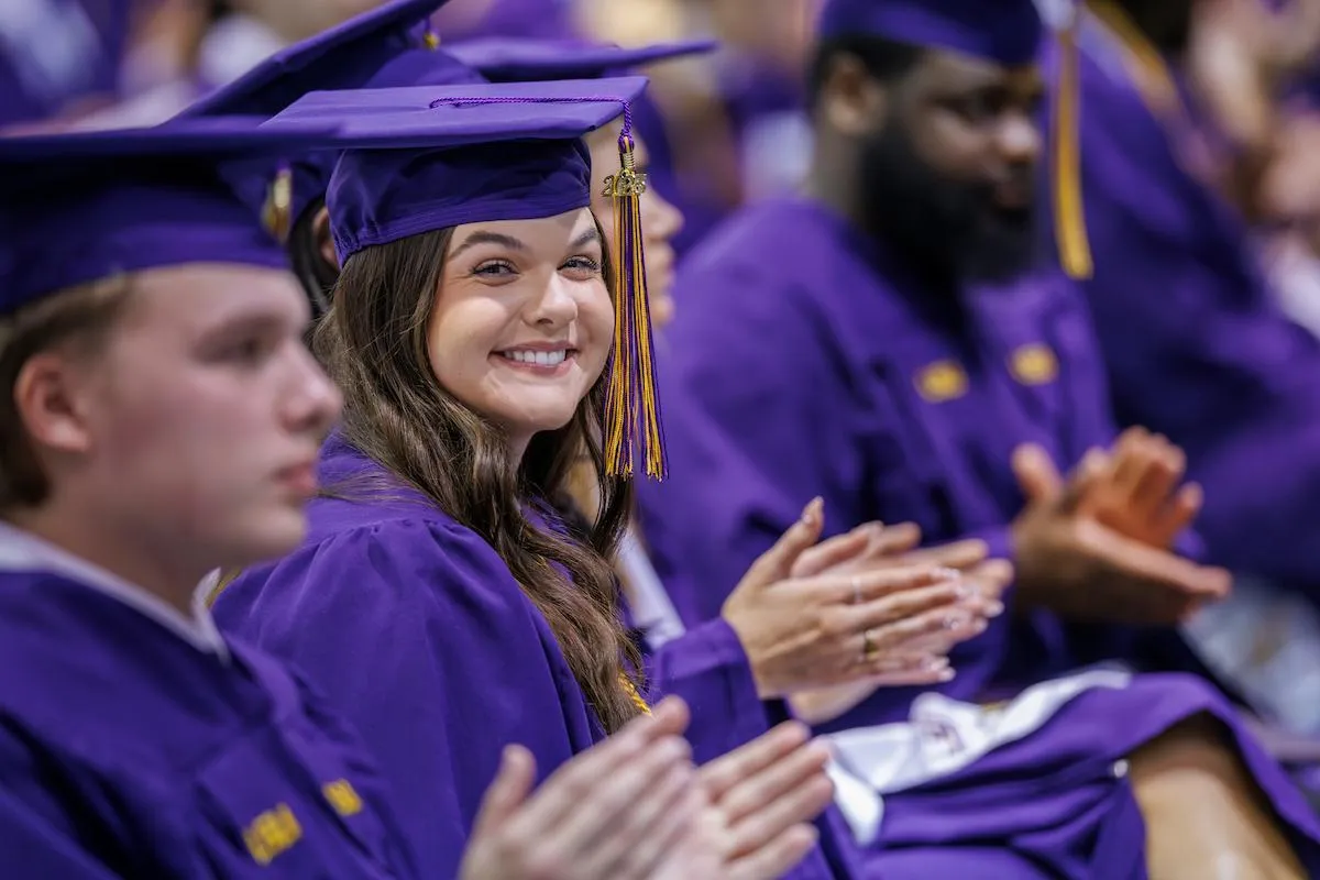 TAM graduates Elliott Koehler-Albert, Klaire Deggs, and Kaleb Duncan