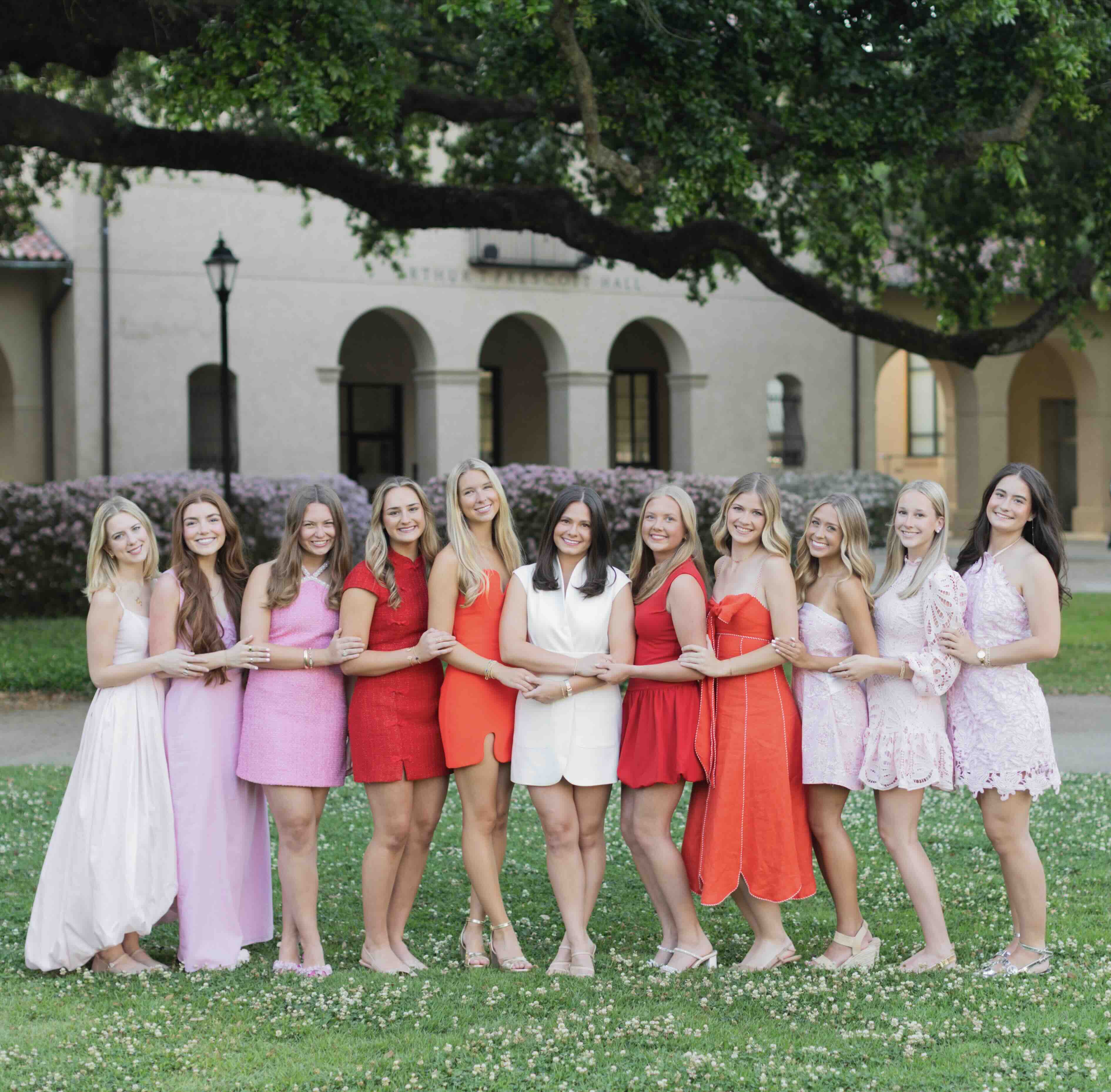 alpha phi members pose outside