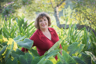 Connie McLeod in front of plants
